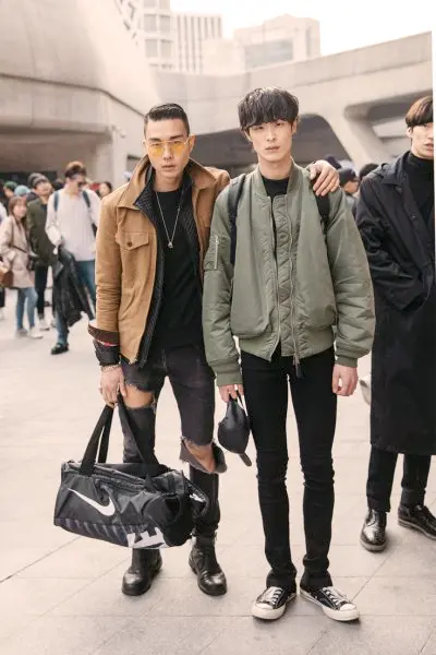 A group of stylish individuals walking down the streets of Seoul, showcasing the eclectic and vibrant street style that defines Korean fashion